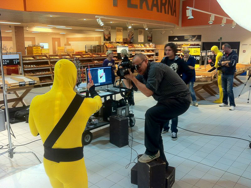 Photographer shooting a campaign scene with professional camera equipment on location