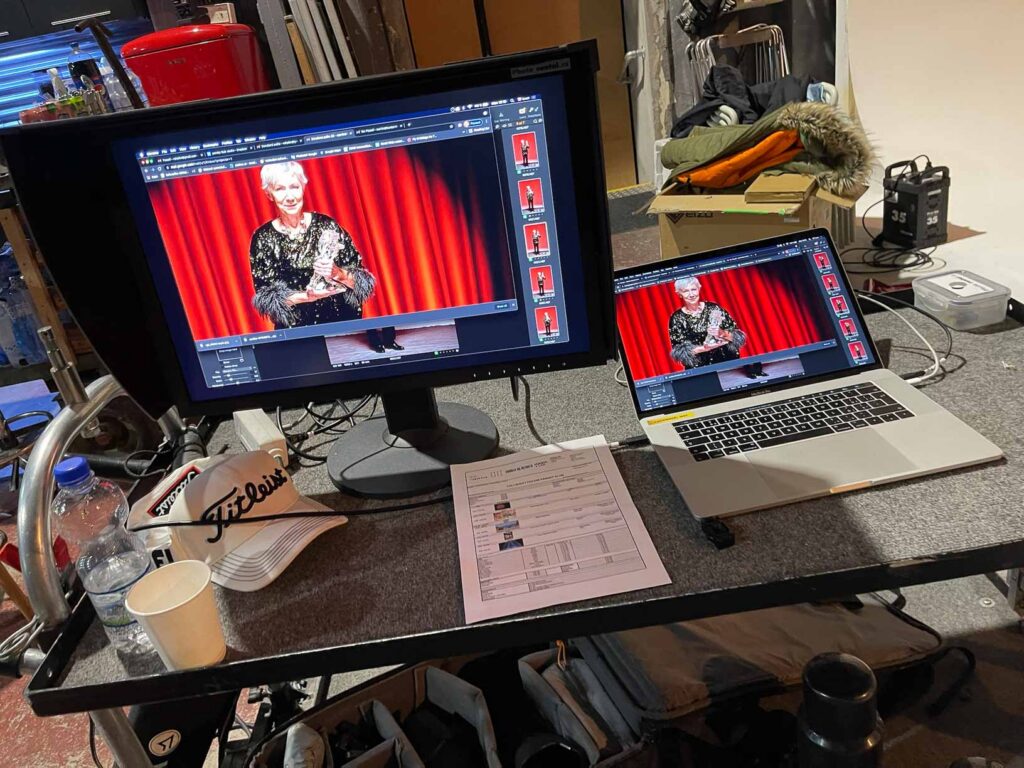 Behind-the-scenes image review on monitors during a commercial photography production